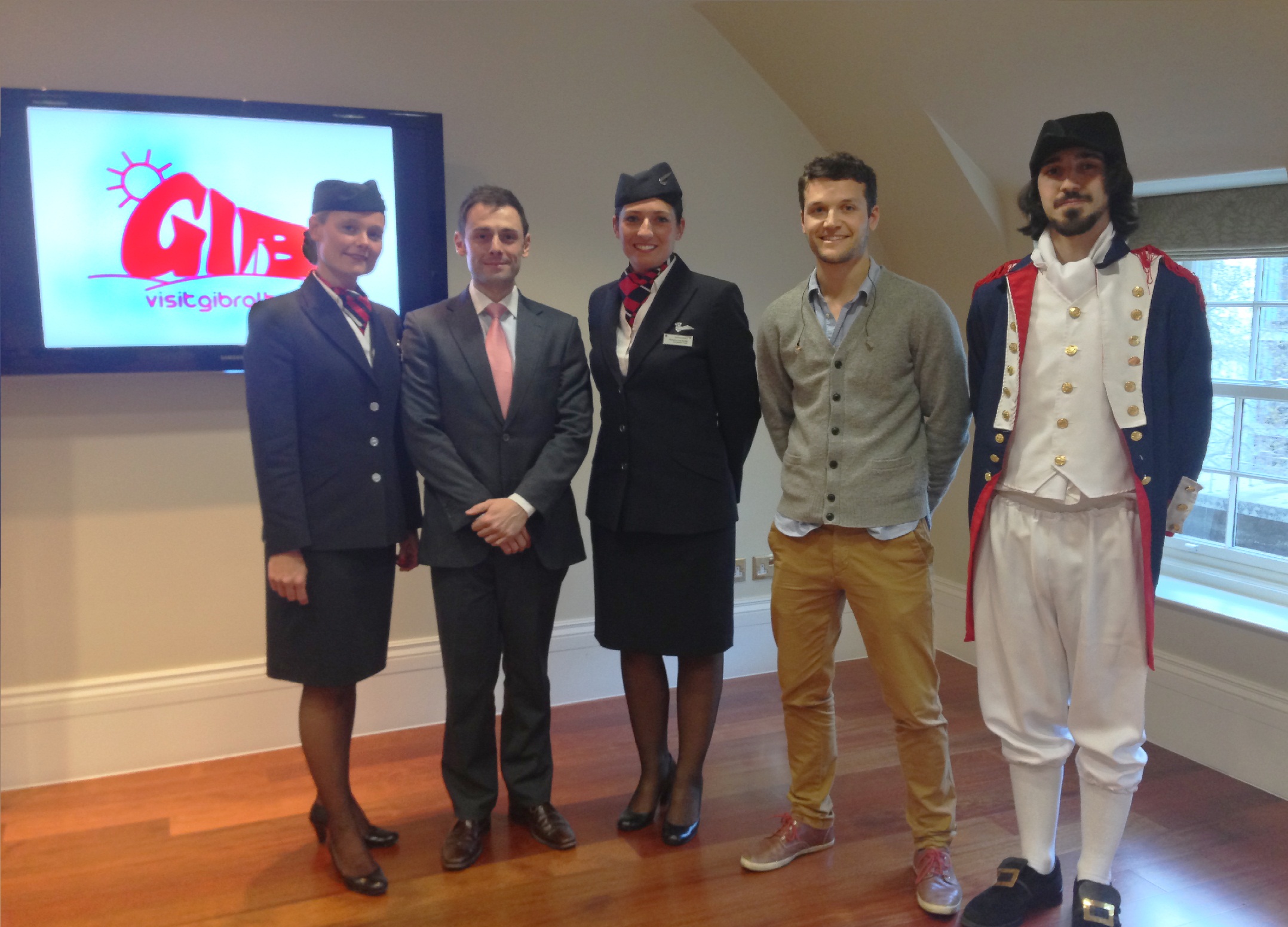Minister Costa with BA cabin crew and Guy Valarino. Also in the picture is Gibraltarian student Nathan Baldachino who welcomed the guests in period costume..JPG